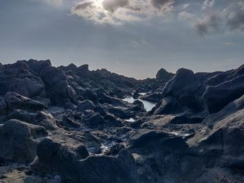 Scenic view of rock formations against sky