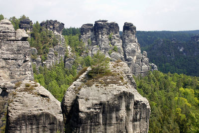 View of rock formation on landscape against sky