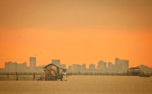 Scenic view of sea against sky during sunset