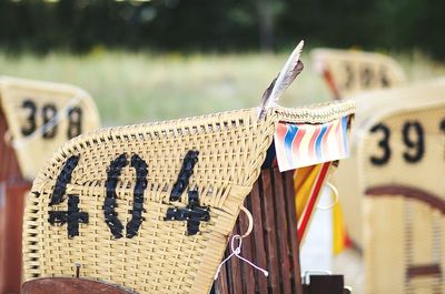 Close-up of hooded beach chairs during sunny day