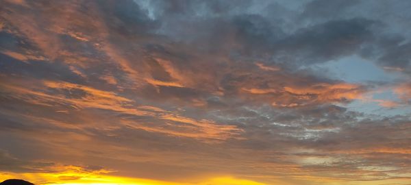 Low angle view of dramatic sky during sunset