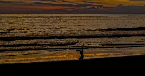 Scenic view of sea against sky at sunset