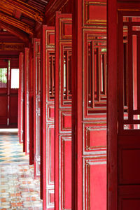 Red doors in the hallway in purple forbidden city, imperial city