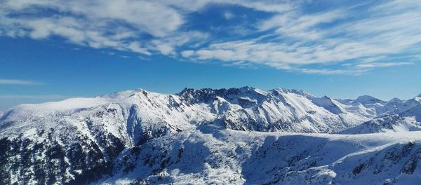 Scenic view of snow covered mountains