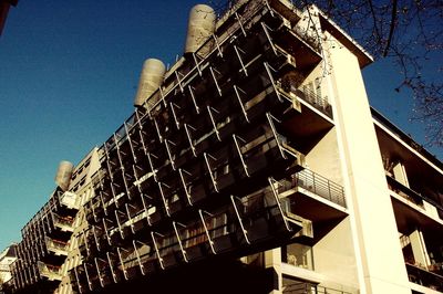 Low angle view of buildings against blue sky