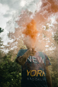 Rear view of a person standing against the sky