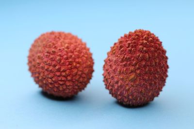 Close-up of strawberries on table against white background