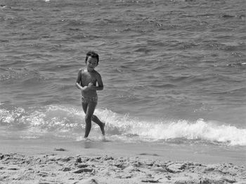 Boy playing on the beach