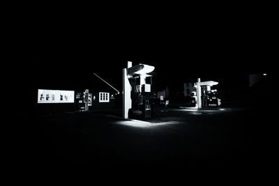 Illuminated road sign at night