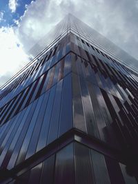 Low angle view of building against cloudy sky