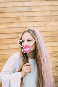 Portrait of young woman wearing sunglasses