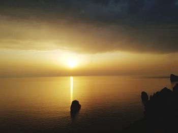 Scenic view of sea against sky during sunset