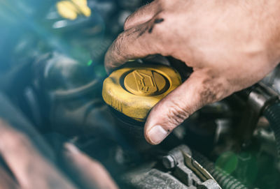 Close-up of mechanic repairing car