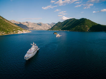 High angle view of boats in sea against sky