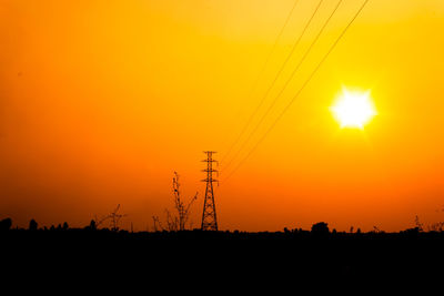 Silhouette landscape against sky during sunset