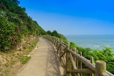 Hiking trail along the rocks and the ocean. way of the camino de santiago