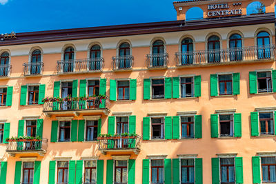 Low angle view of building against clear blue sky