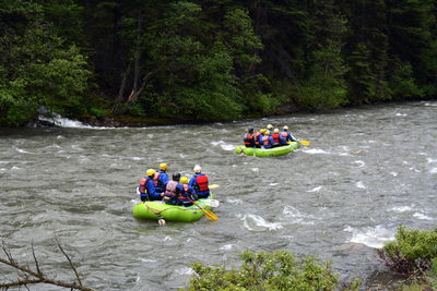 Rear view of people rafting in gallatin river