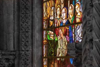 Close-up of multi colored glass window of building