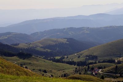 Scenic view of landscape and mountains against sky