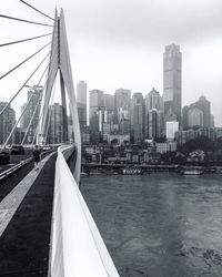 Bridge over river with buildings in background