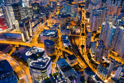 High angle view of city lit up at night