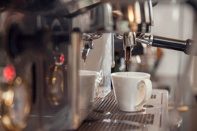 Close-up of coffee cups in cafe