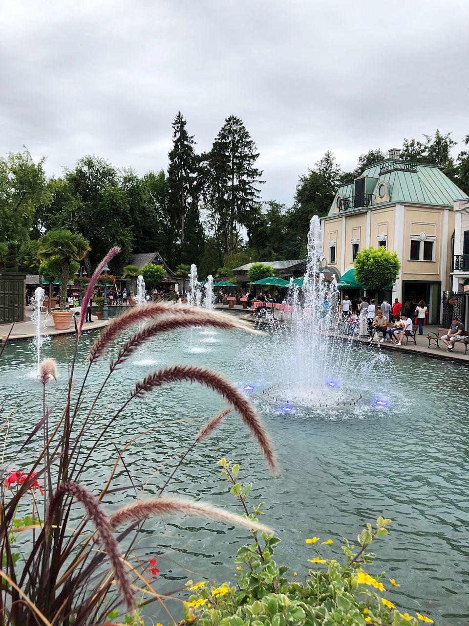 WATER FOUNTAIN IN SWIMMING POOL AGAINST BUILDING