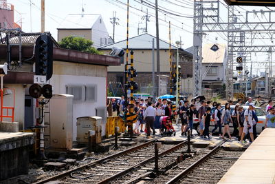 People crossing on railroad tracks