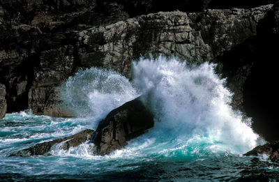 Water crashing over rocks at lewis coastline