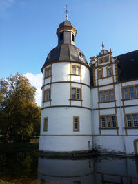 Low angle view of built structure against clear blue sky