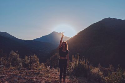 Man standing by mountains against sky