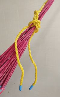 High angle view of multi colored rope tied on table