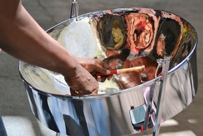 Cropped image of man with solar cooker