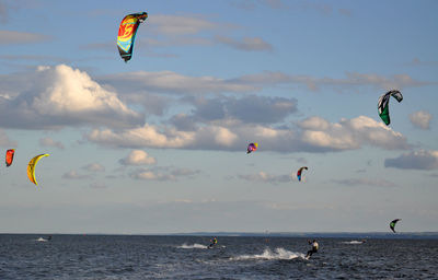 High angle view of people surfing in sea