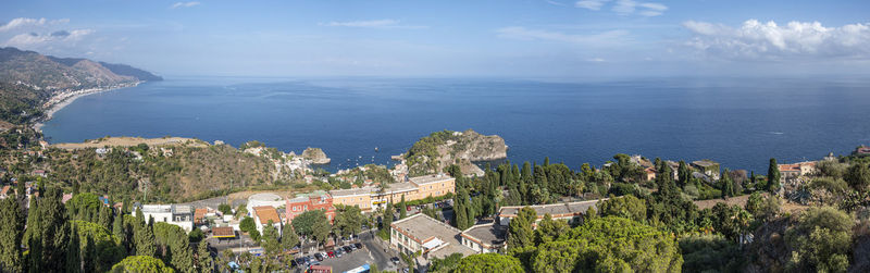 Aerial wide angle view of taormina and its beautiful coastline