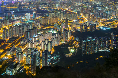 Aerial view of city lit up at night