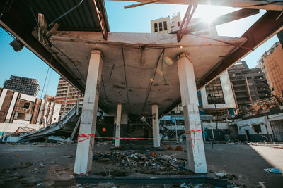 Abandoned building against sky in city