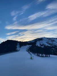 Scenic view of snow covered landscape against sky