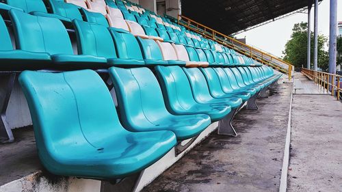 Empty seats in row against the wall