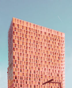 Low angle view of building against clear blue sky