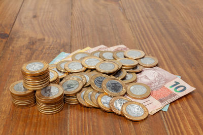 High angle view of coins on table