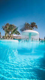 View of swimming pool against blue sky