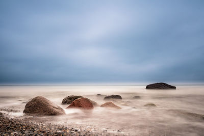 Scenic view of beach against sky