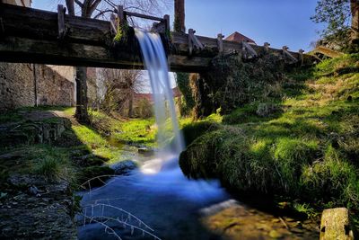 Water flowing through rocks in forest