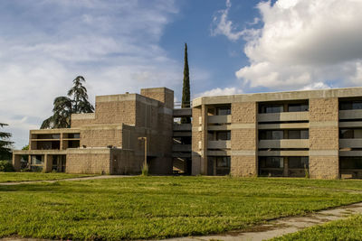 View of buildings against cloudy sky