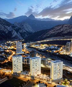 High angle view of townscape and mountains against sky