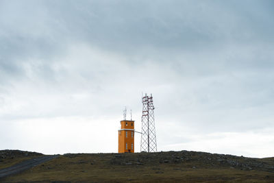 Lighthouse on the eastern coast of iceland, set against a cloudy sky