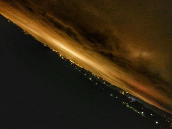 Low angle view of illuminated sky at night