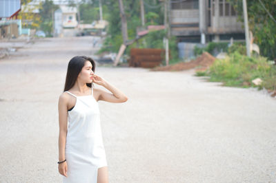 Woman standing in a city